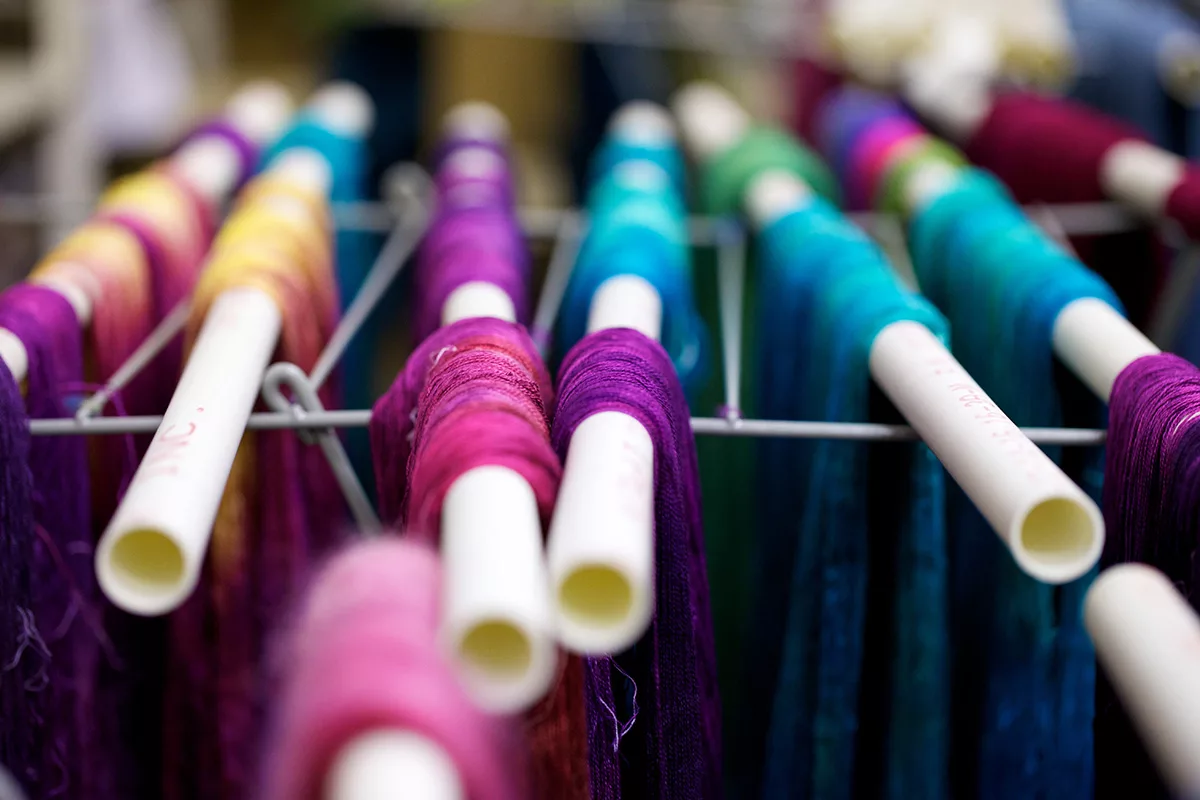 Hand-Dyed Silk Yarn, hanging to dry at the SweetGeorgia Studio