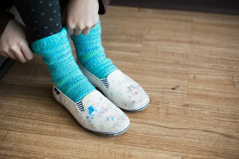 Charlotte's first hand-knit socks. Photo by Felicia Lo