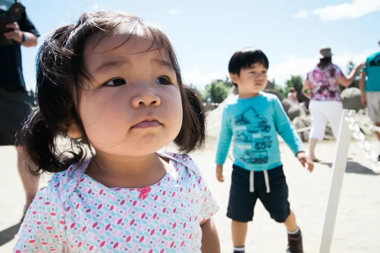 Nina and Russell looking at the sand sculptures on the beach in Parksville, Vancouver Island.
