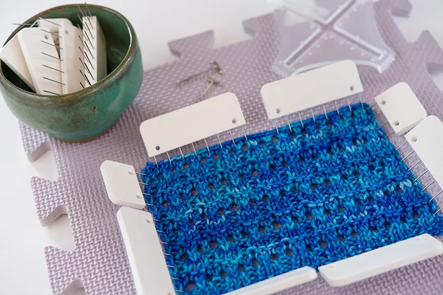 Blocking a lace gauge swatch on a blocking mat