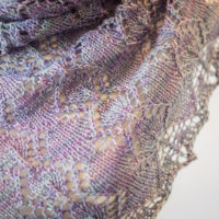 Heathered Sunset lace shawl knitting pattern knit in Tough Love Sock Magician