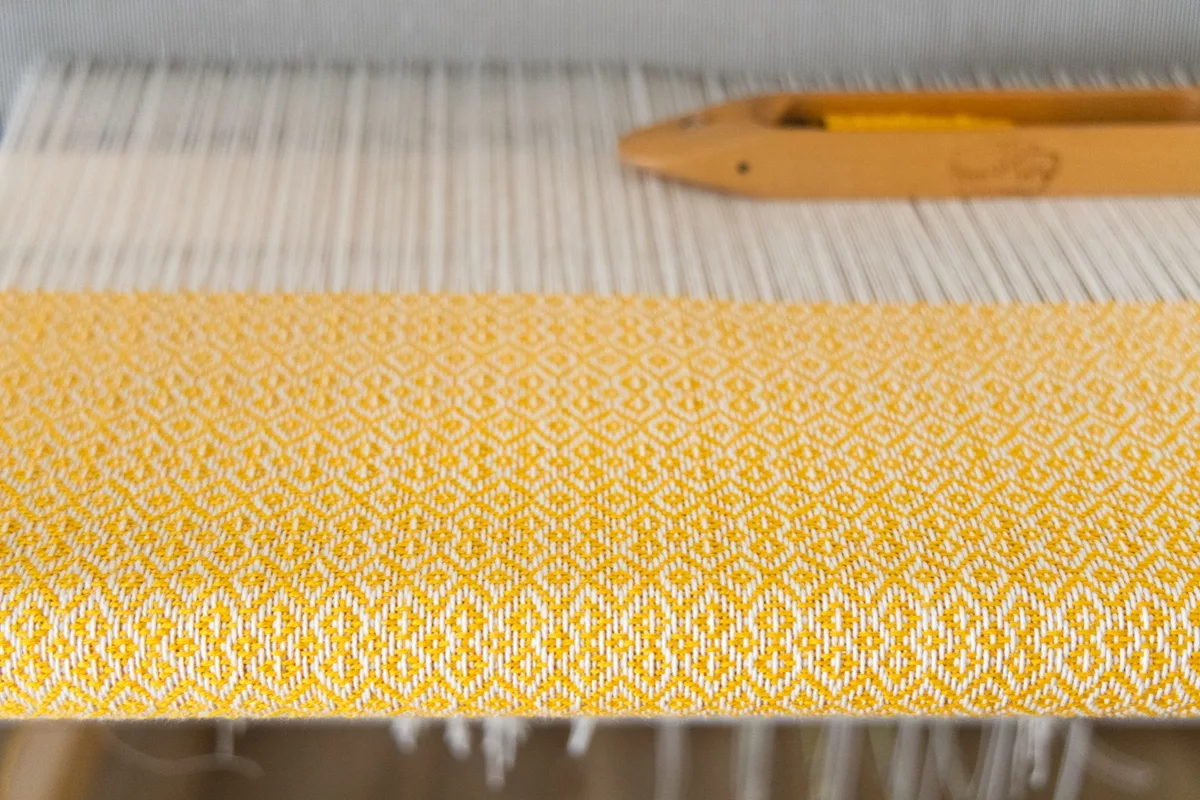 Handwoven twill baby blanket in-progress using Gist Beam organic cotton yarn