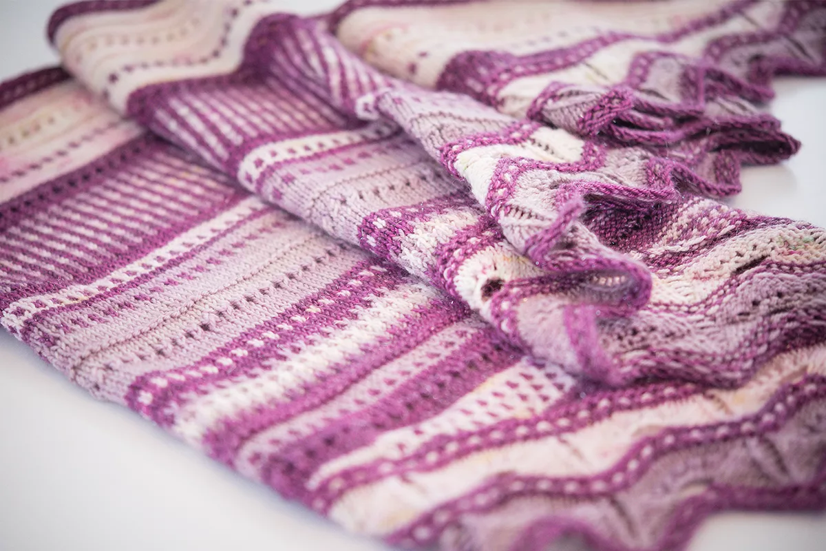 purple shawl laid flat on table