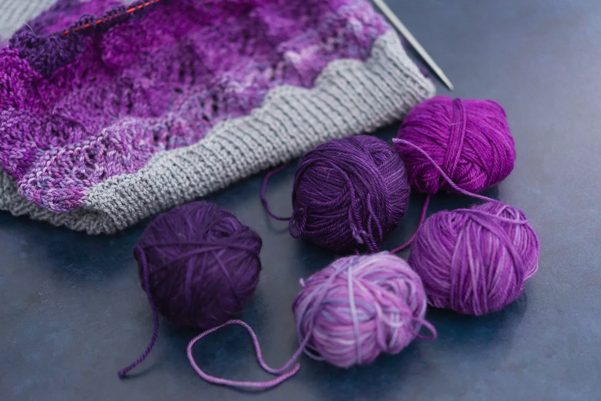 five mini balls of purple yarn for the sgy spring lace-along practice shawl 