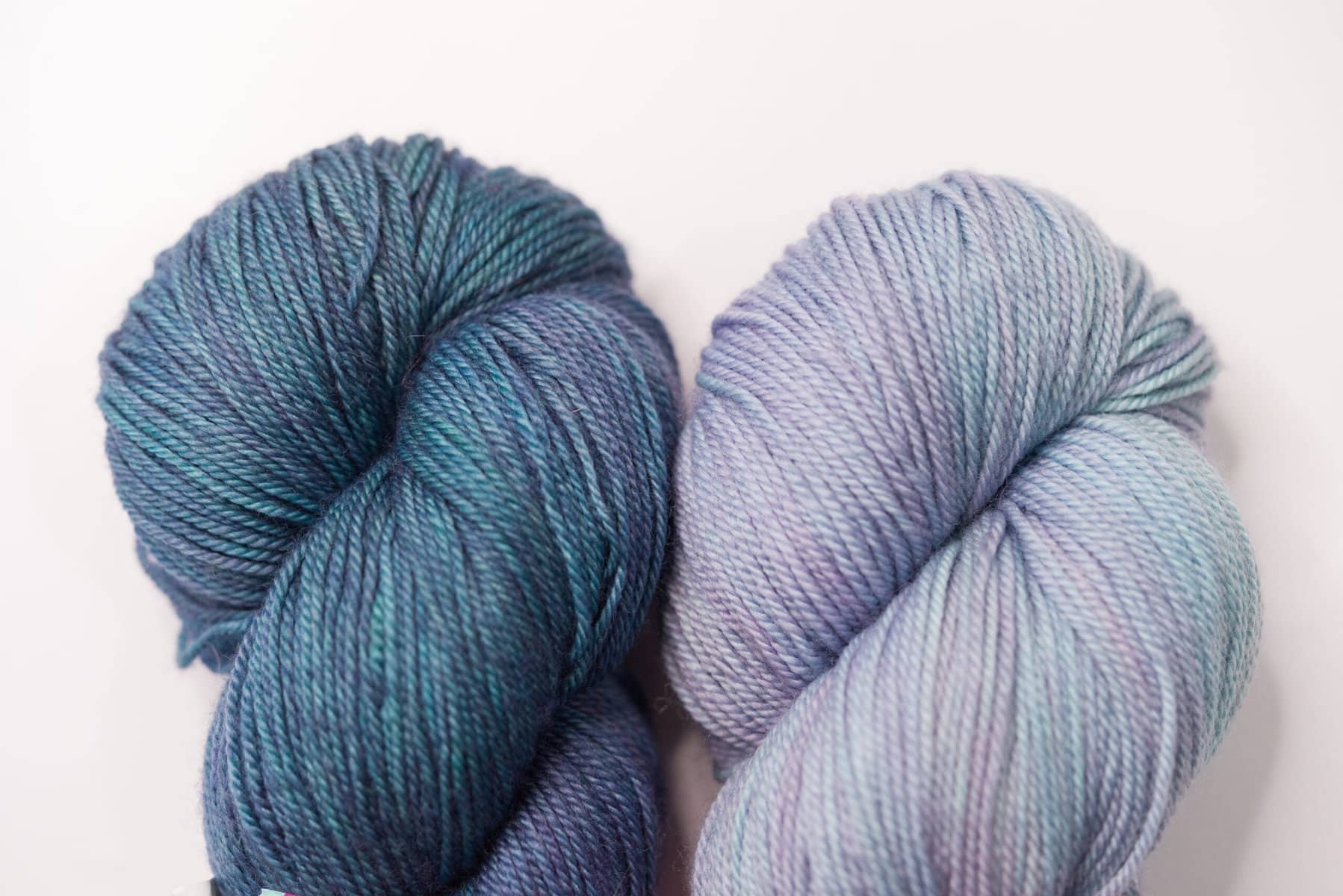 High saturation blue yarn and low saturation blue yarn to show the difference between hue, value, and saturation
