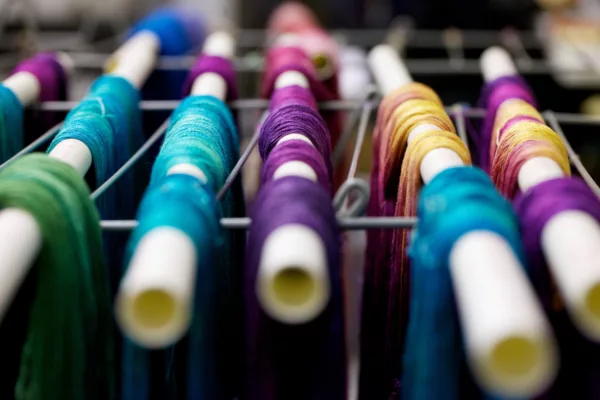Hand-dyed silk yarn drying at the SweetGeorgia Studio