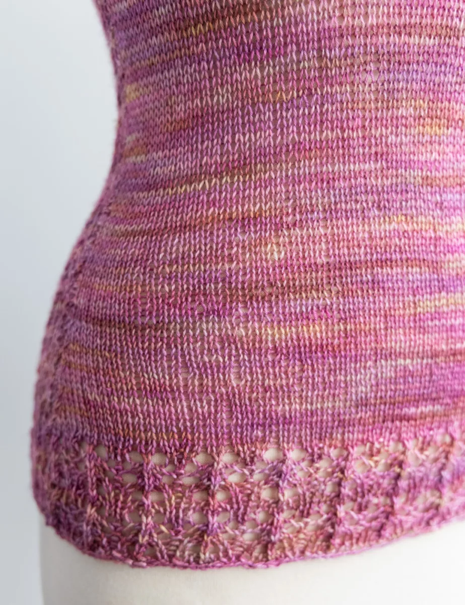 Close-up of front panel of Early Dewdrops sleeveless tee knit in Rose-Coloured Glasses colourway