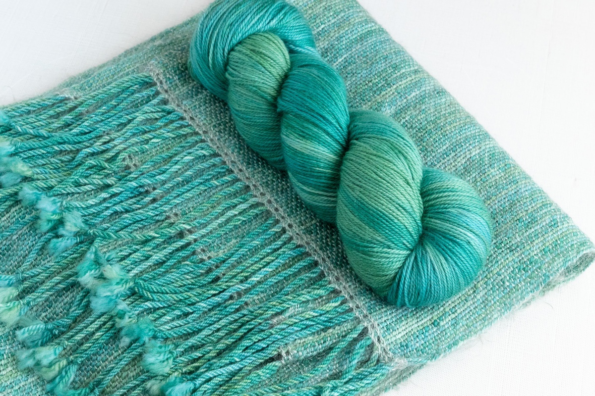 Handwoven scarf sample in Life of Plants Secret Stash Club colourway for May 2024
