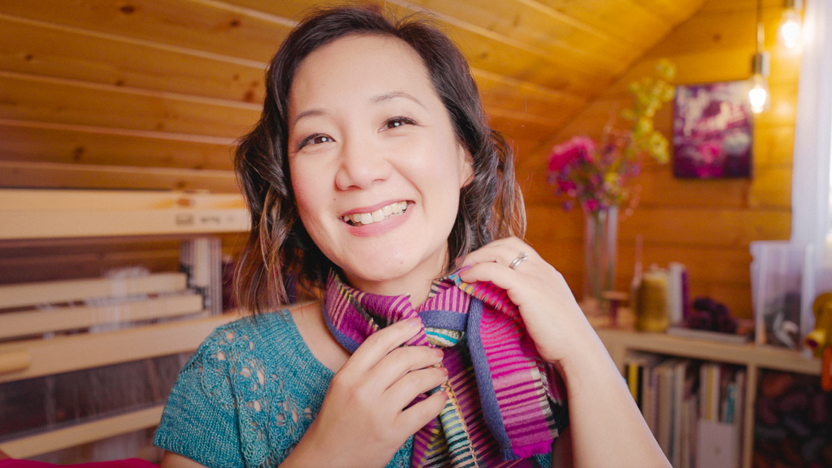 Felicia Lo wearing handwoven scarf