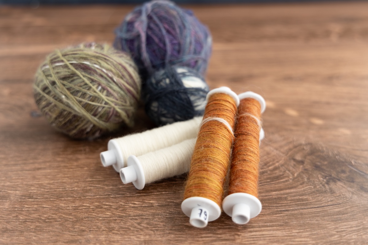 Spun singles on a weaving bobbin