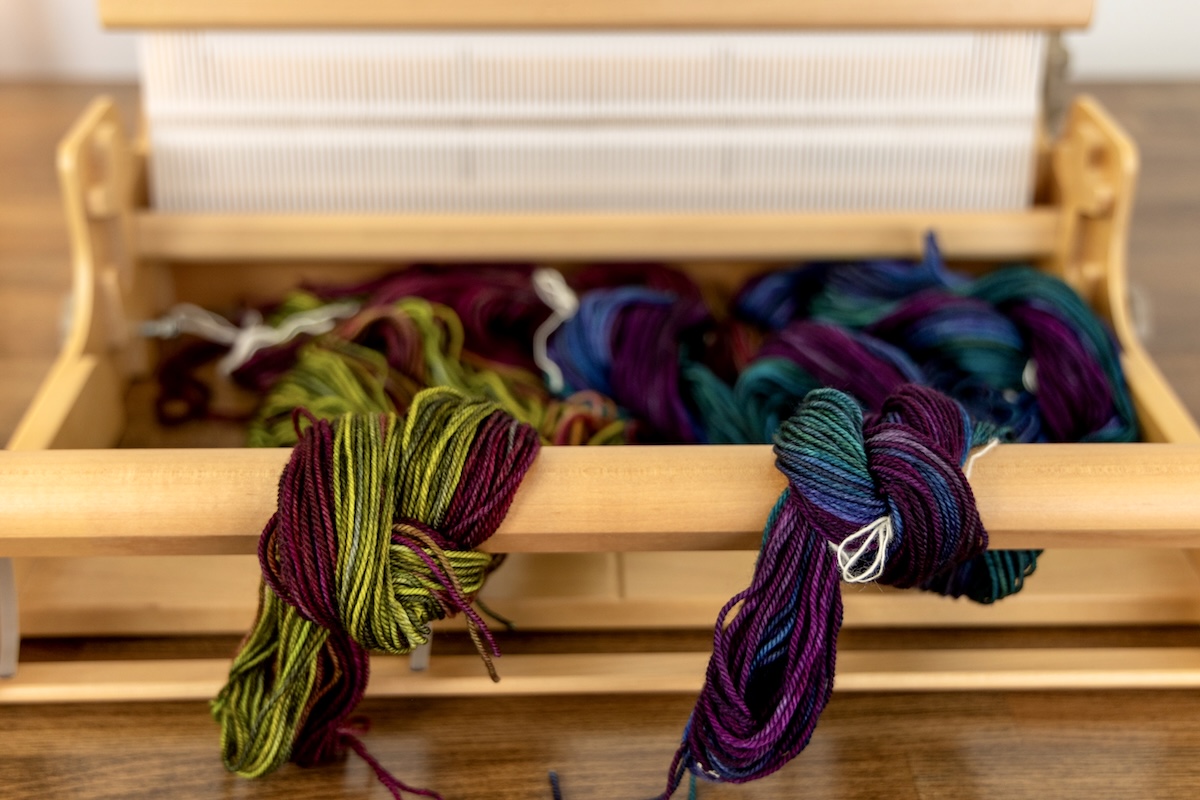 Supplies needed for indirect warping are laid out on a table