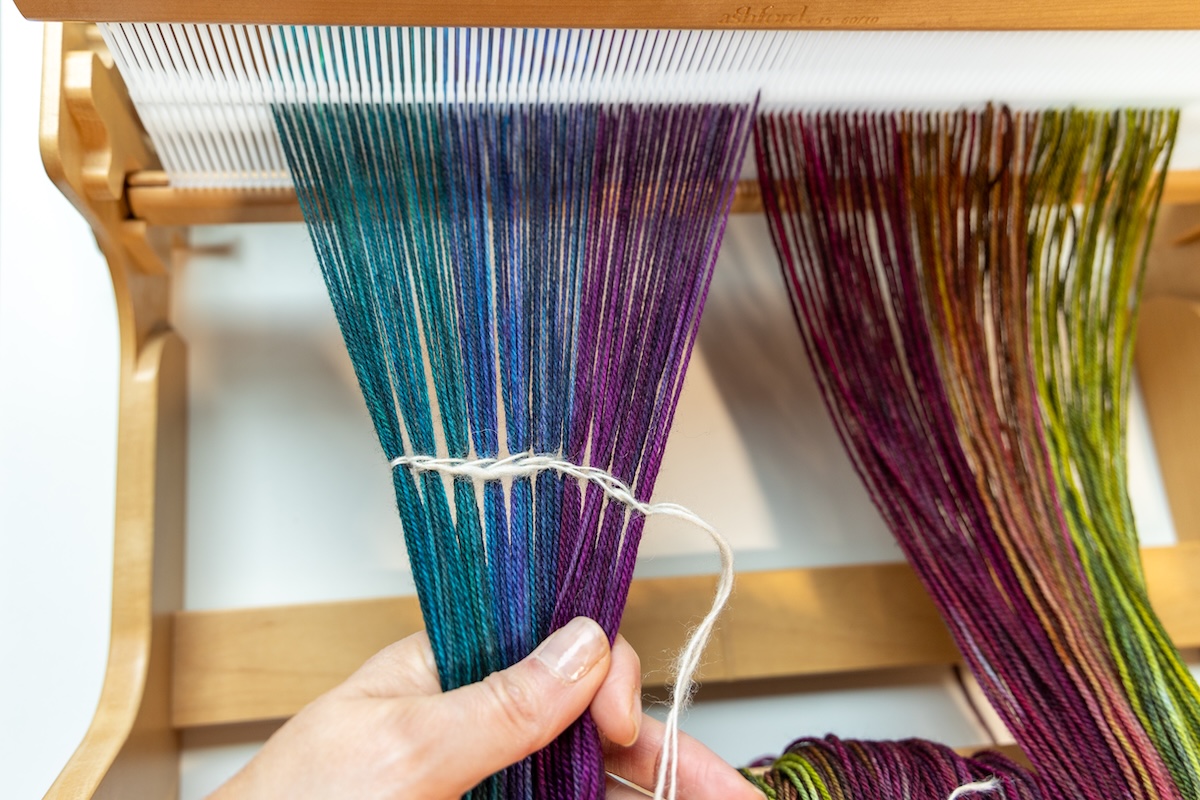 a colourful warp with a white counting thread.