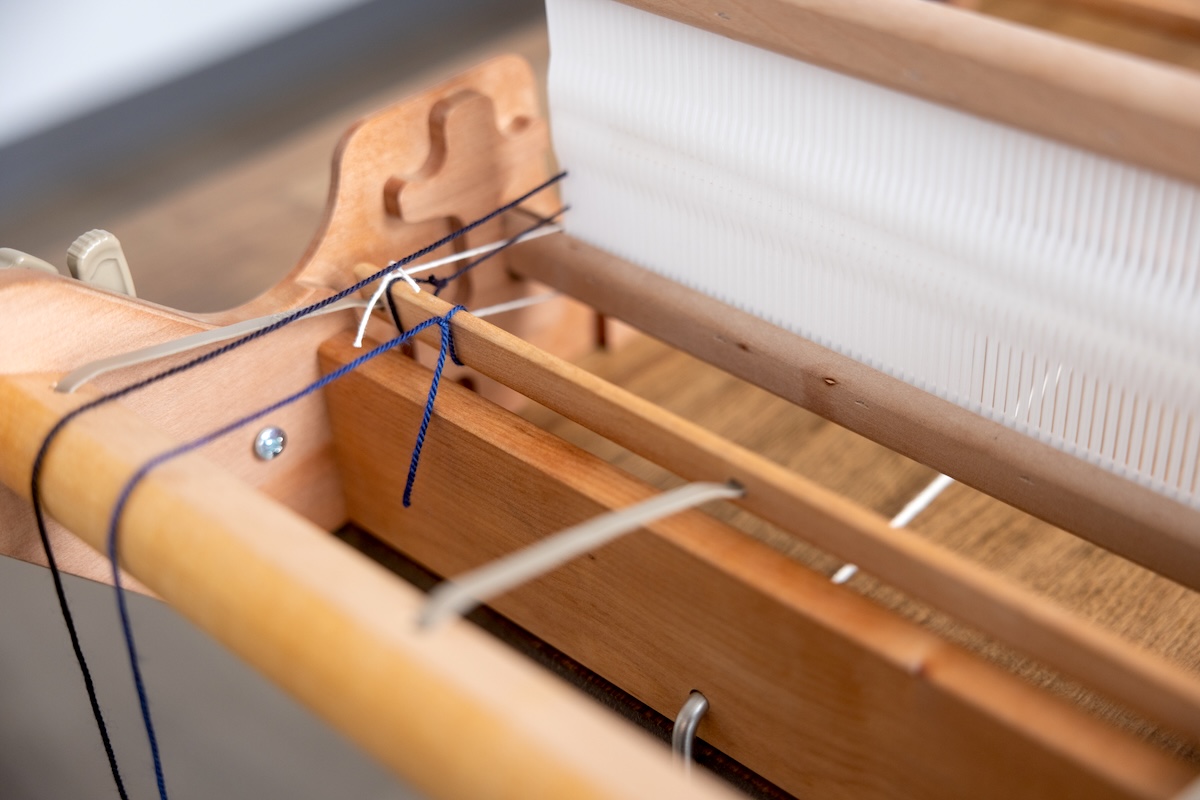 The Best of Both: Exploring Hybrid Warping: warp attached to back beam of loom