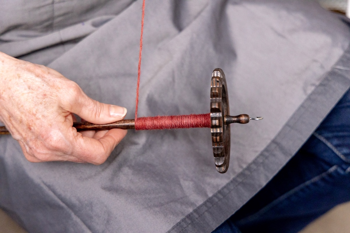 Chain-plied yarn on a Snyder Gear-style suspended spindle. 