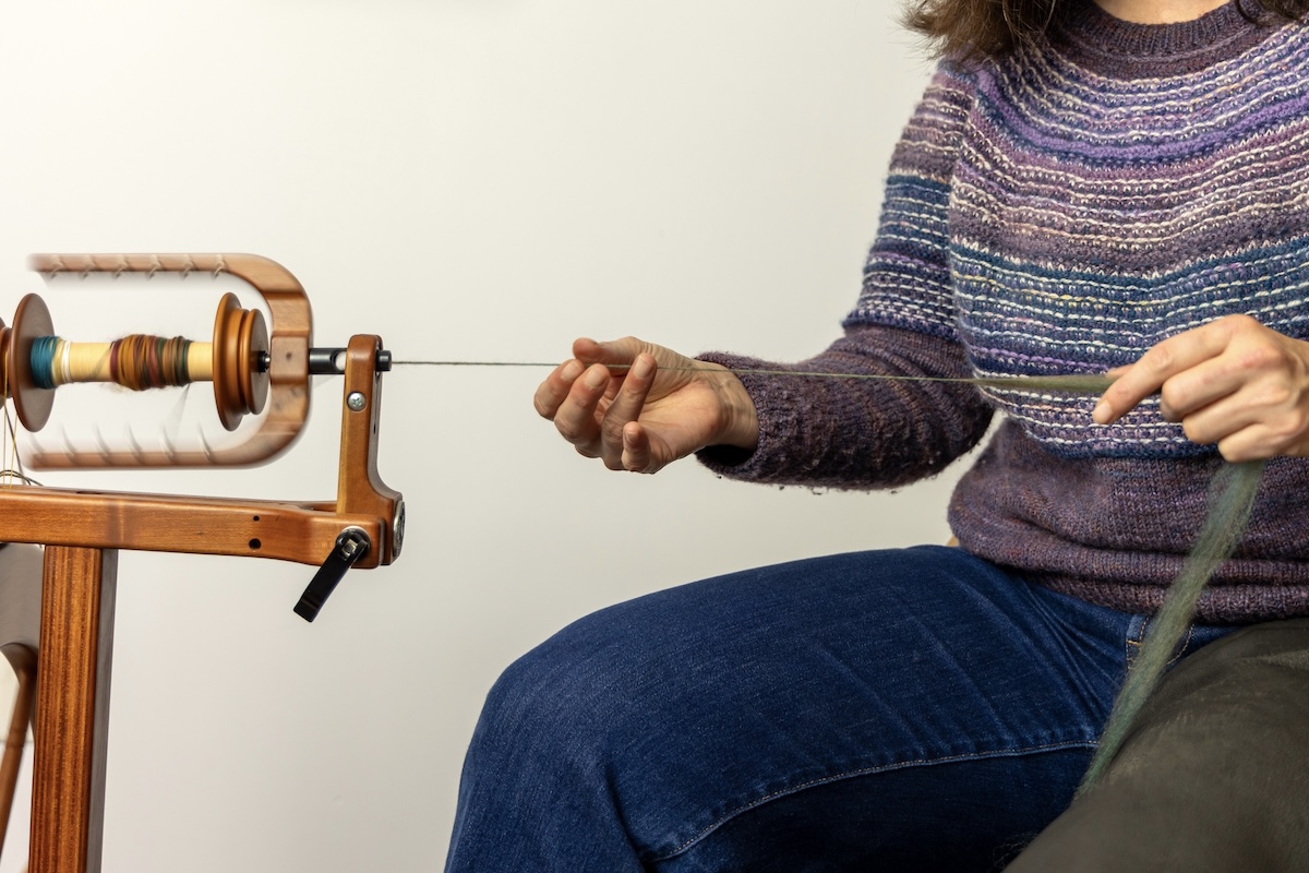 a spinner practicing long draw point of contact spinning 
