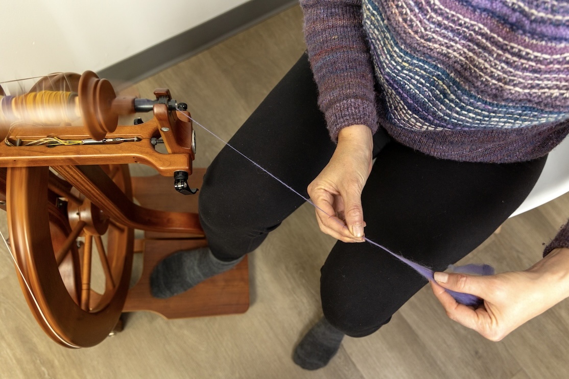 sitting at an angle to the wheel while spinning