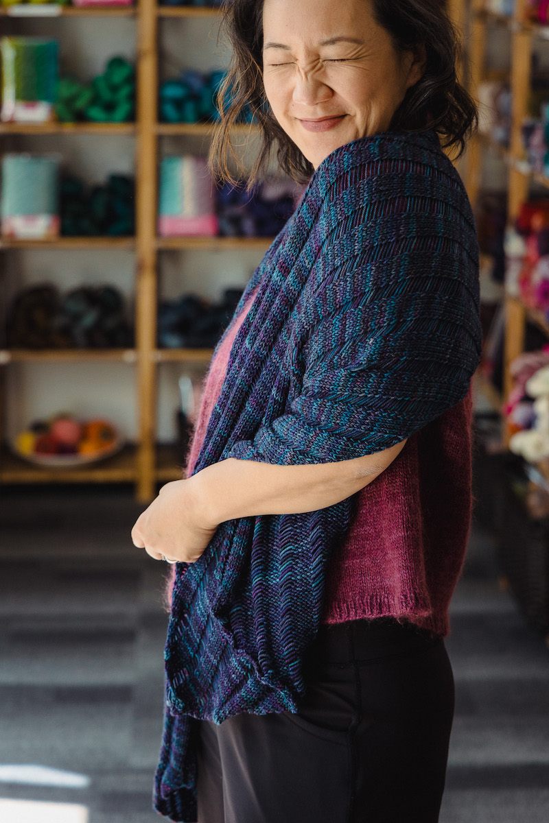 Felicia Lo of SweetGeorgia wearing the Clapotis knit shawl
