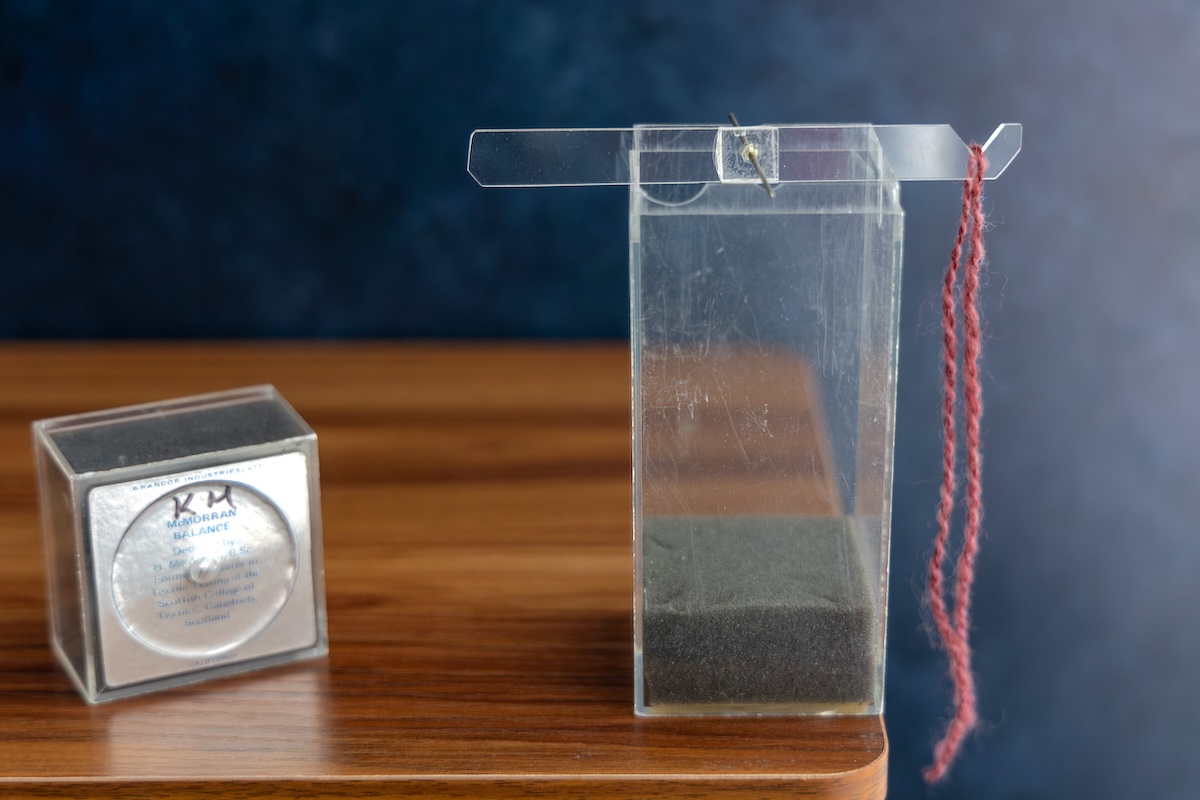 Measuring yarn on a McMorran Balance.