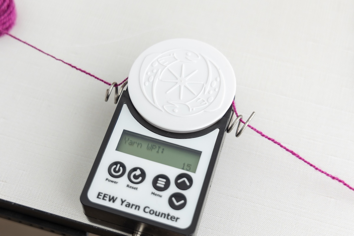 Measuring yarn on a EEW Yarn Counter.