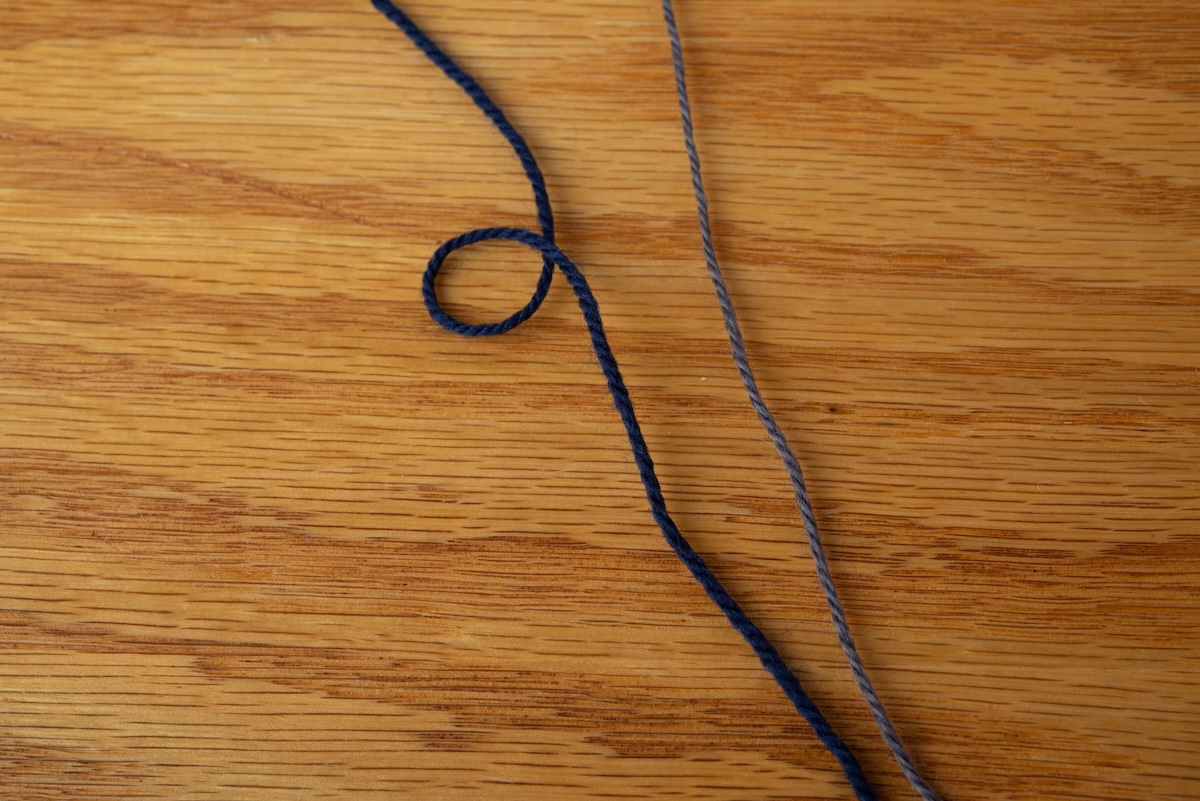 Comparing two DK-weight yarns shows how structure affects appearance, performance, gauge, and fabric behaviour.