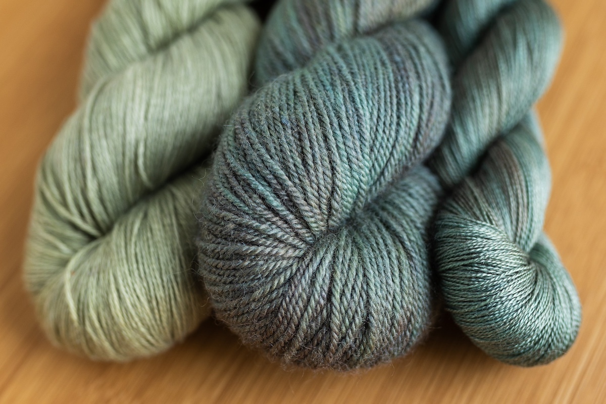 SweetGeorgia Flaxen Silk (flax/silk) in Sage, SweetGeorgia BFL+Silk DK (wool/silk) in Winter Haven, and SweetGeorgia 20/2 Mulberry Silk (100% silk) in Winter Haven;