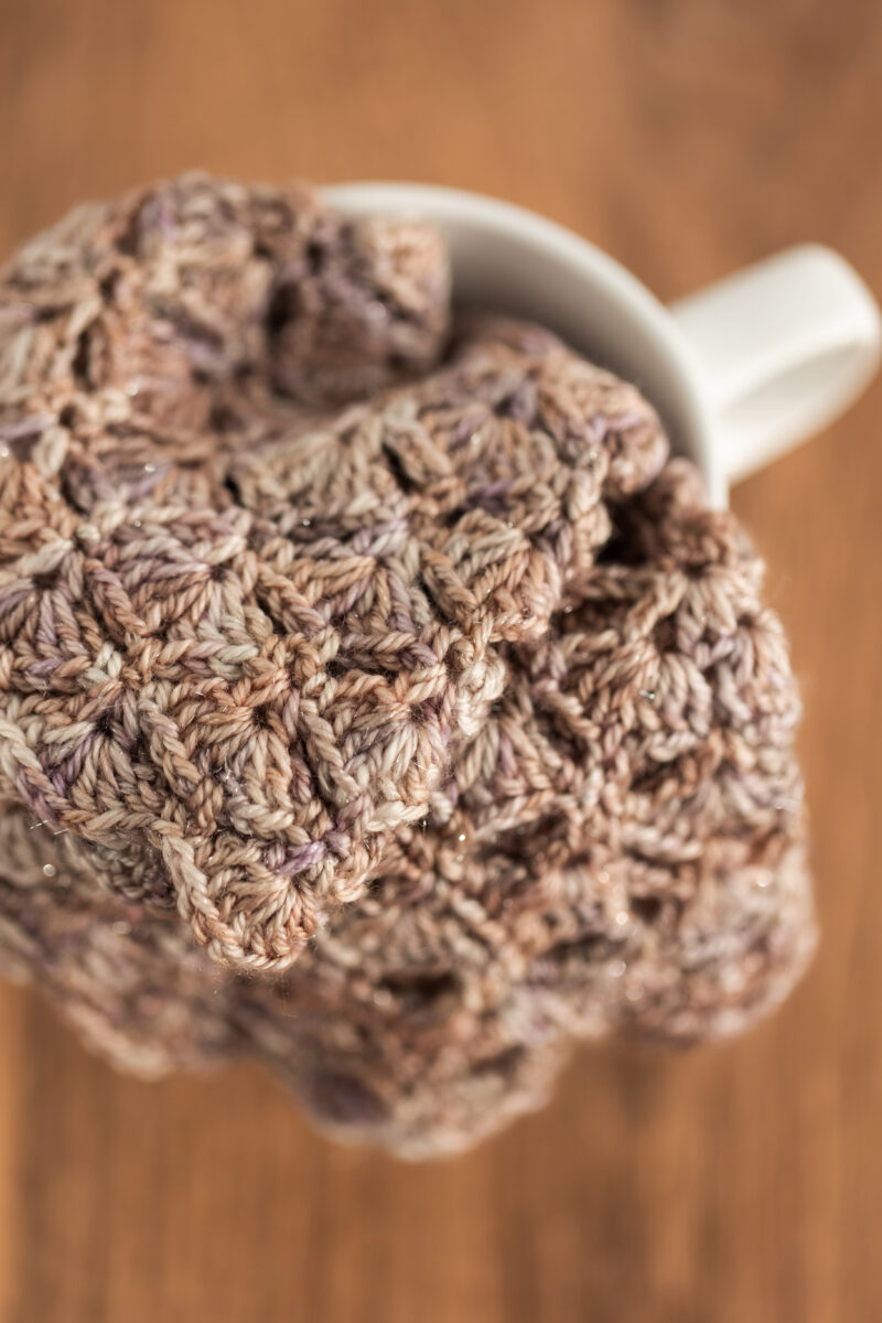 Crochet fingerless gloves in Secret Stash Club colourway for December 2024