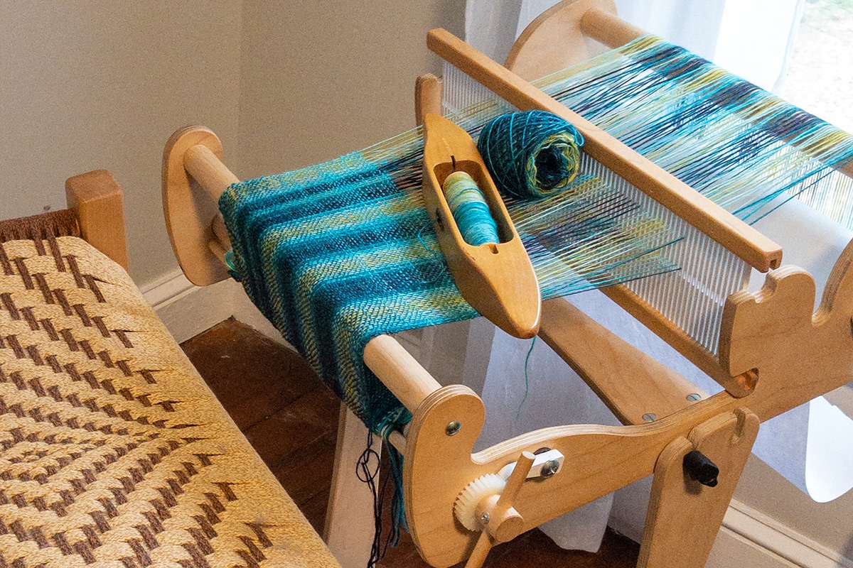 a rigid heddle loom on a stand