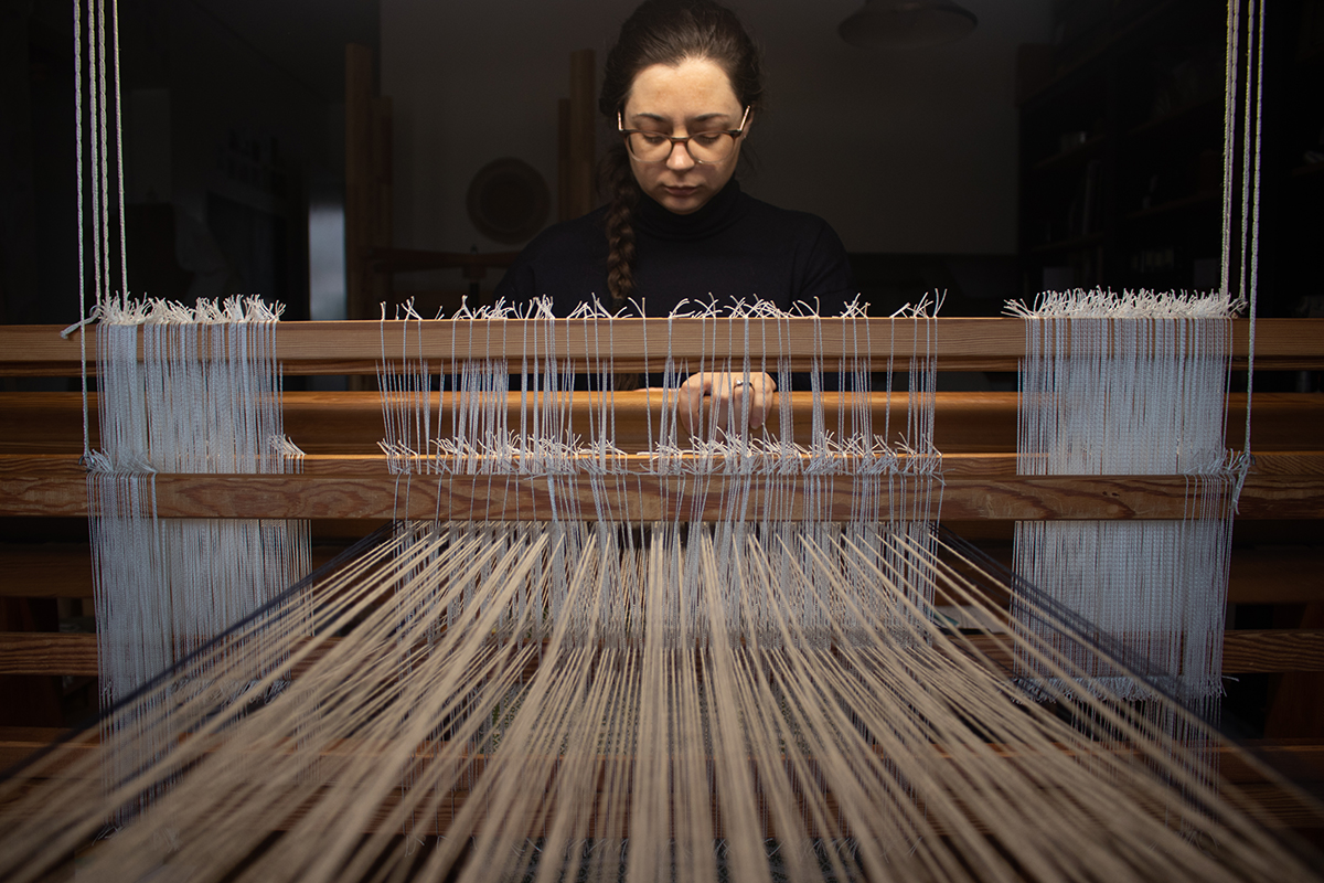 Amanda weaving on her loom.