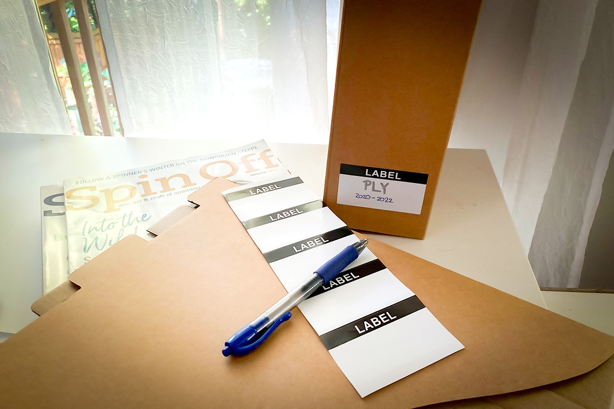 Magazine holders with sticker labels