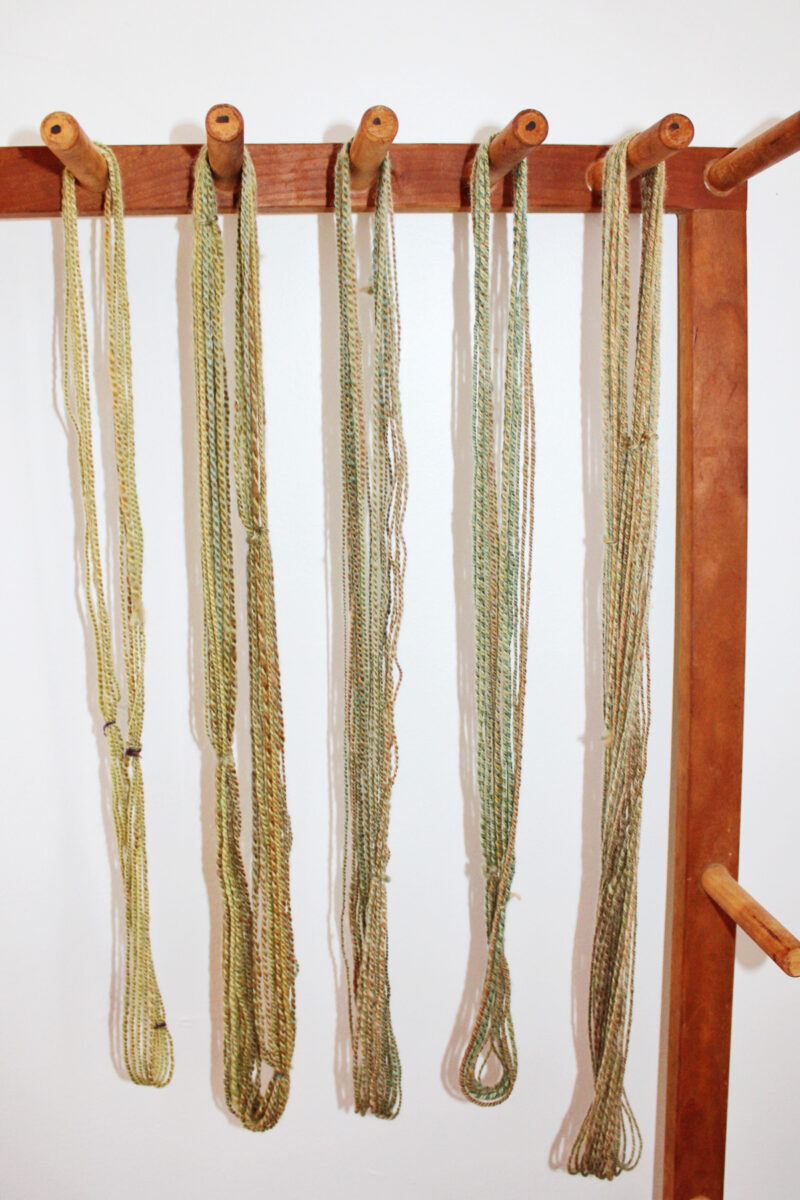 wet finished and non-finished handspun hanks side by side 