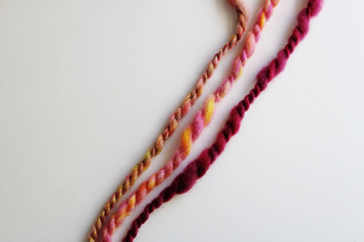 three strands of handspun yarn