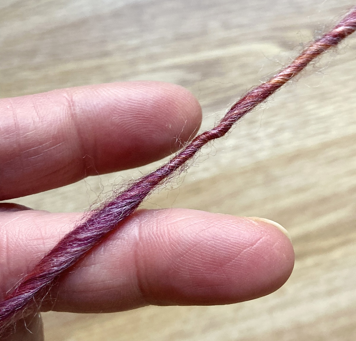 A singles where the twist is higher in the thin spot
