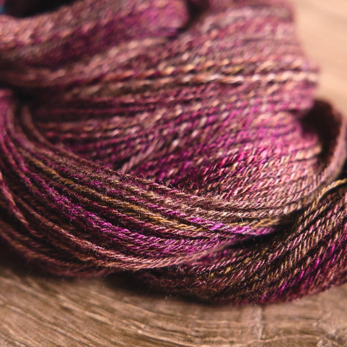 Felicia's three-ply handspun fractal yarn in the SweetGeorgia BFL+Silk fibre colourway Salted Caramel.