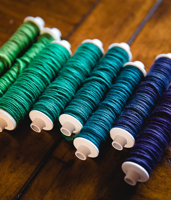 weaving bobbins would in Party of Five mini-skein yarn set in Emerald