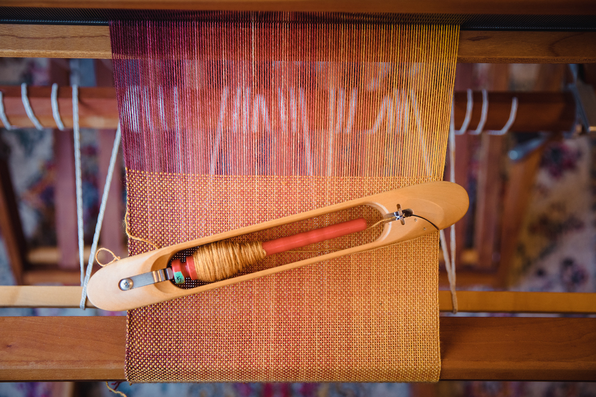 Sock blank scarf weaving in-progress using hand-dyed gradient yarn