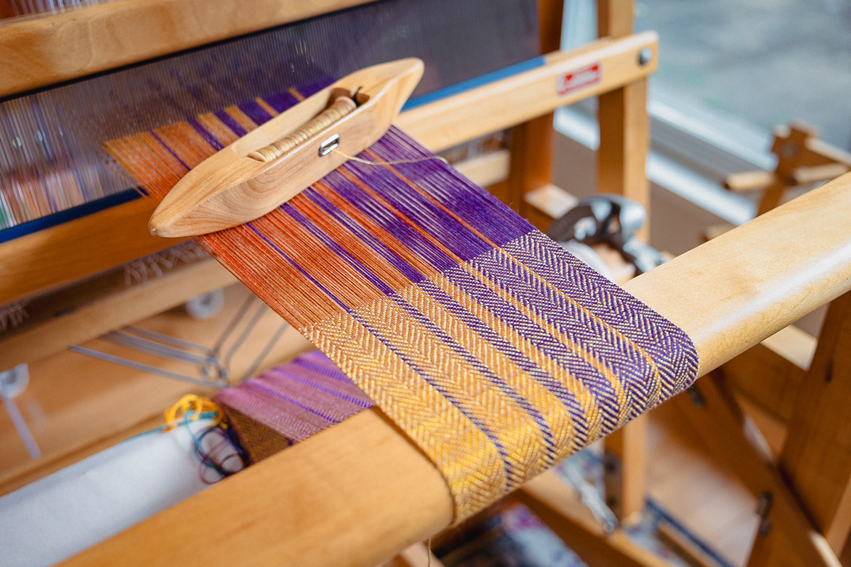 Weaving the Sunset Scarves pattern by Felicia Lo