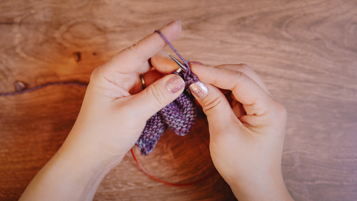 Continental purl: enter the right needle purlwise into the stitch, working yarn held in the left hand.