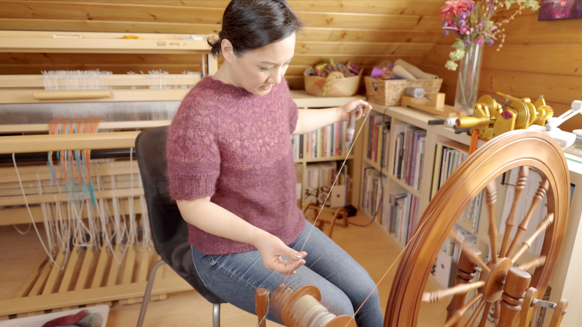 Felicia spinning long draw on a wheel