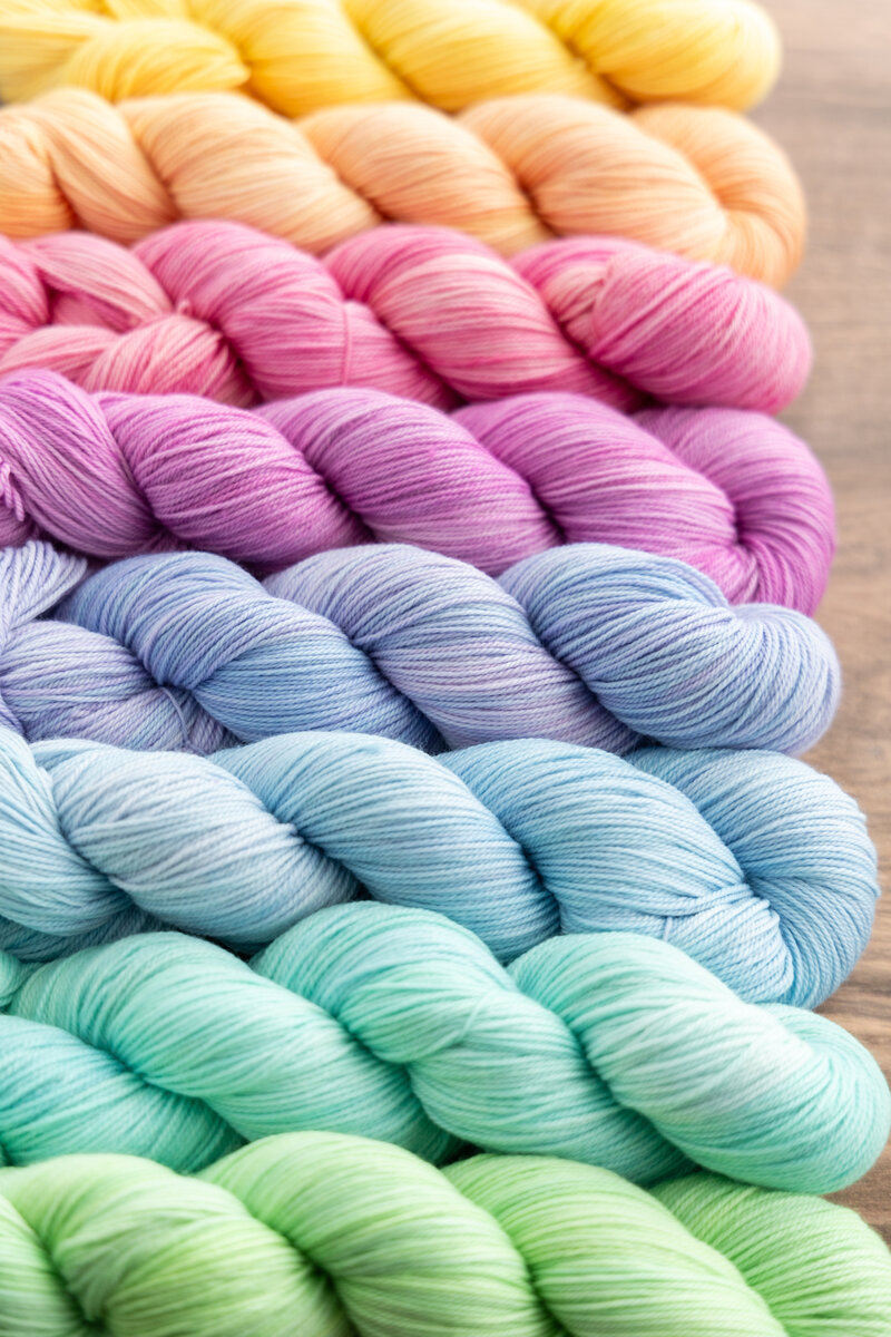 Enlighten Collection yarn skeins hand-dyed on SweetGeorgia Tough Love Sock