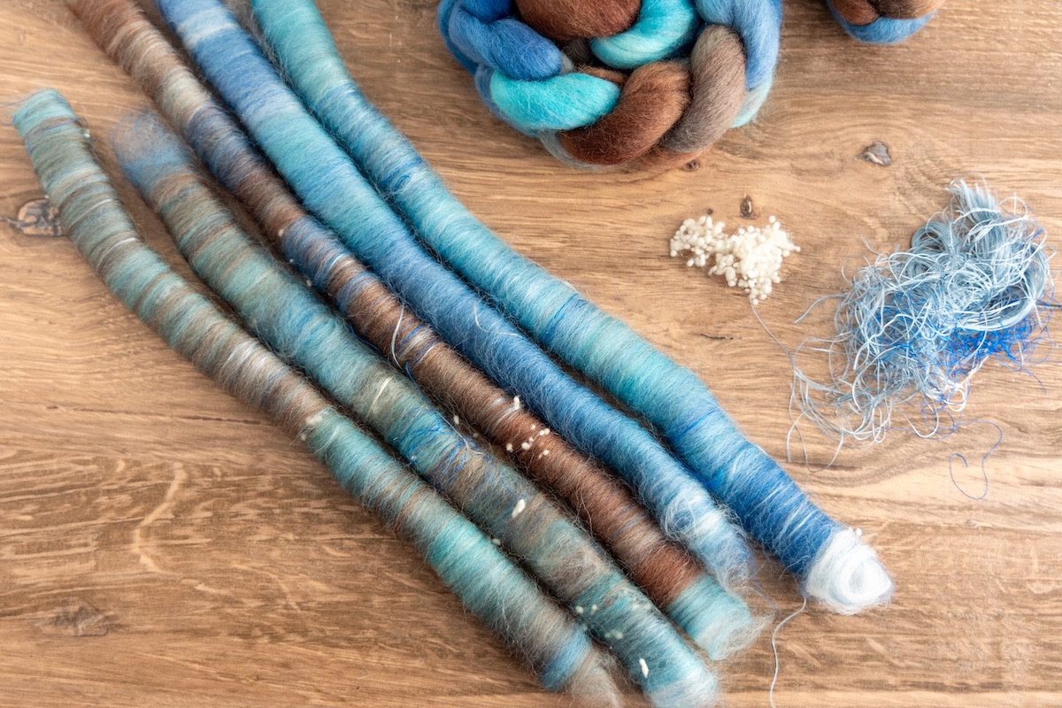 Here, we see silk noil enhancing the SweetGeorgia River Walk colourway on Corriedale fibre, but this time with the addition of banana fibre, creating a beautifully layered and interesting blend.