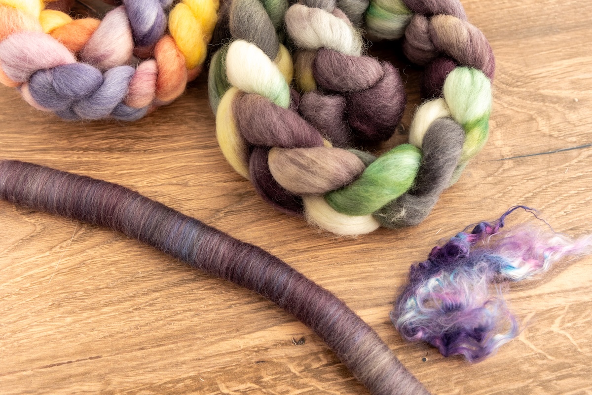 Although this blend looks similar to the one above, it was created using only the purples from the SweetGeorgia Wensley’s Field and Shadows on Snow colourways on Corriedale fibre. The addition of purple silk creates deep, moody rolags that will spin into a beautifully tonal and rich yarn.