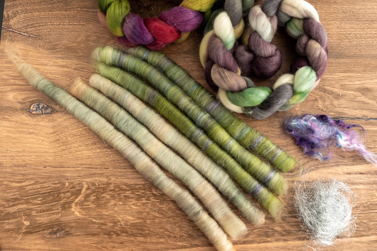 The greens were pulled from the SweetGeorgia Sprinkles of Joy and Shadows on Snow colourways on Corriedale fibre, then blended with silk and Angelina to create beautifully tonal green rolags with depth and shimmer.