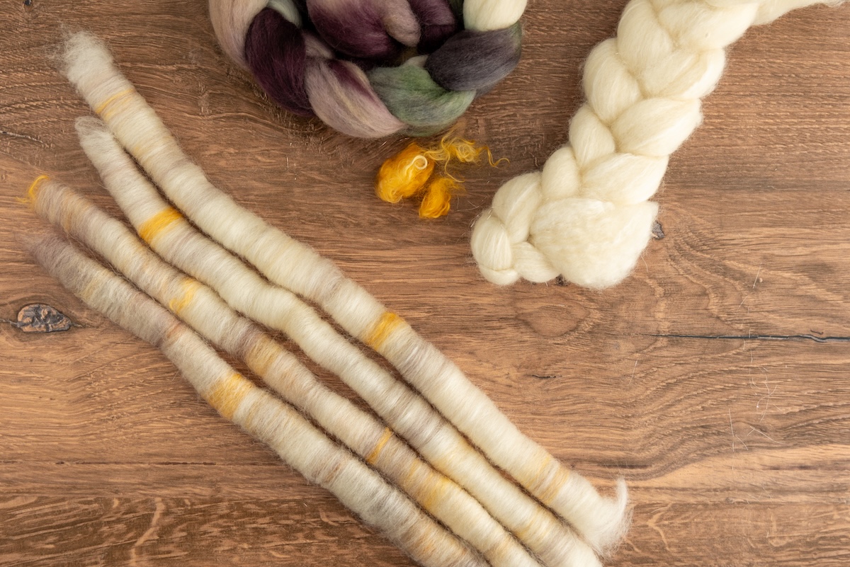 We absolutely loved working with this undyed BFL and silk fibre, adding soft touches of colour from the SweetGeorgia Shadows on Snow colourway in Corriedale fibre, and finishing it off with mohair locks. The result is a beautiful multi-fibre that’s subtle yet a robust blend.