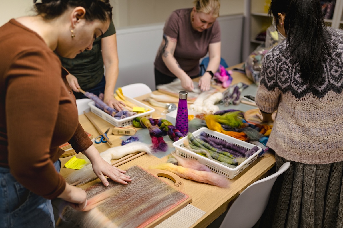 The SweetGeorgia team is making rolags on a professional development day.