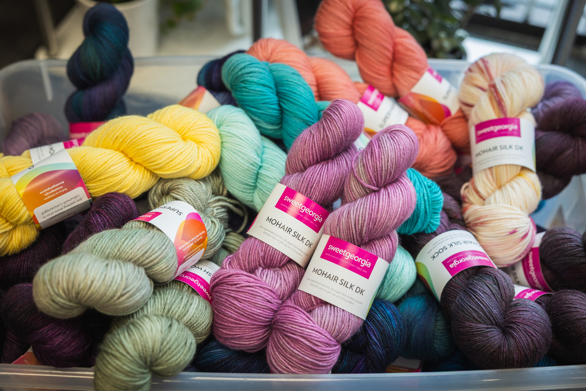 Yarn overflowing from a bin