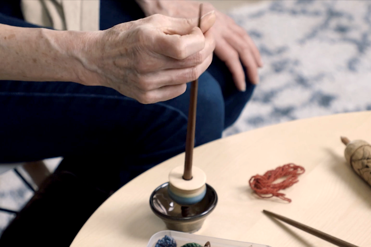 Diana's flicking a spindle