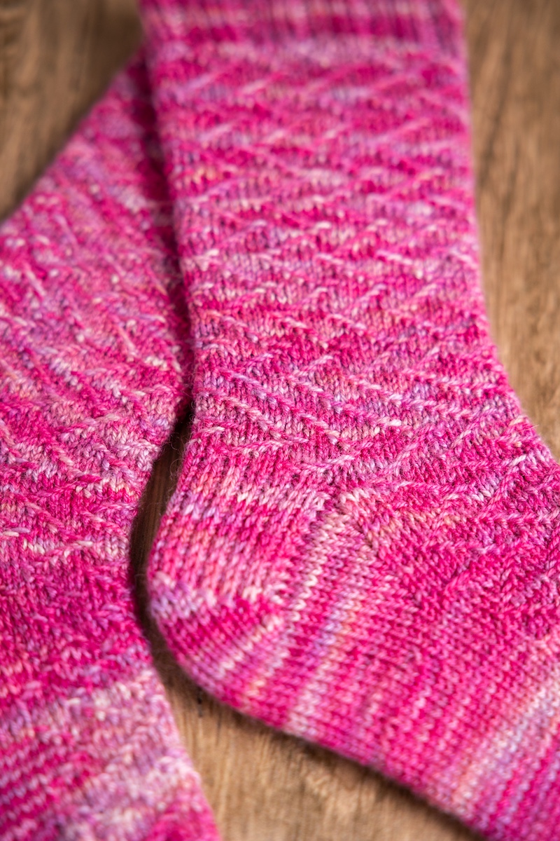 Kelias socks pattern knit in So Kawaii Club colourway