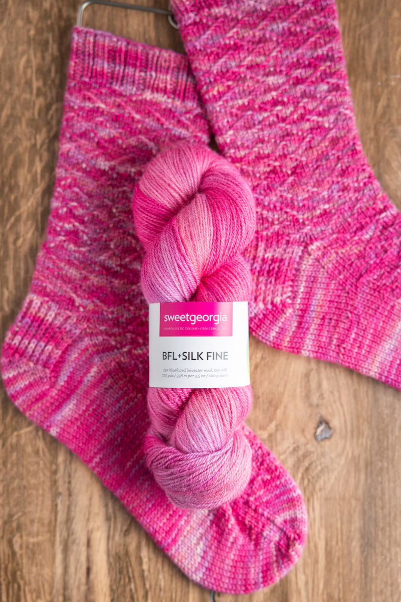 SweetGeorgia BFL+Silk Fine yarn and hand-knit socks flat lay