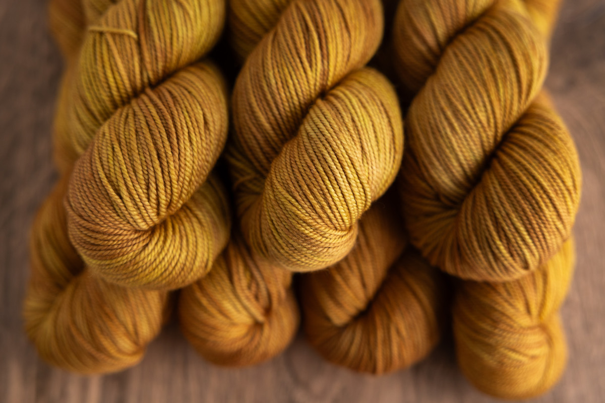 Superwash DK yarn skeins hand-dyed in Honey Gold