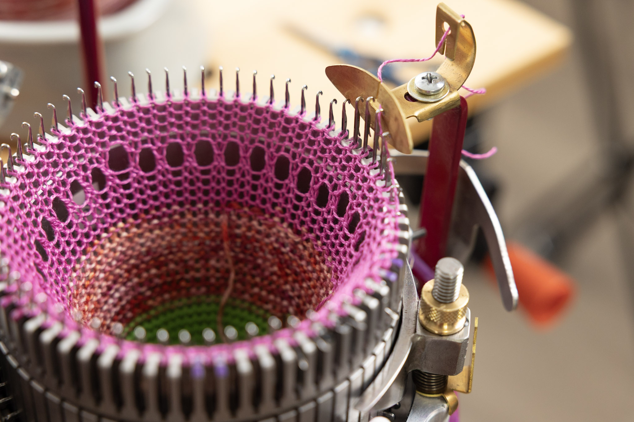 Knitting a sock bonnet on the CSM